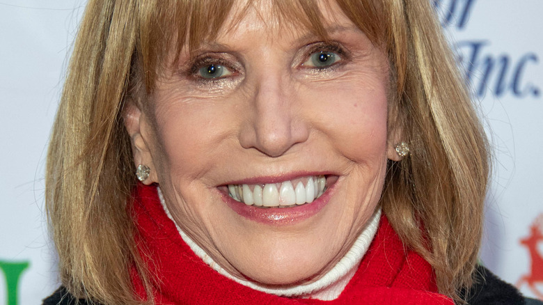 Leslie Charleson wearing a red scarf