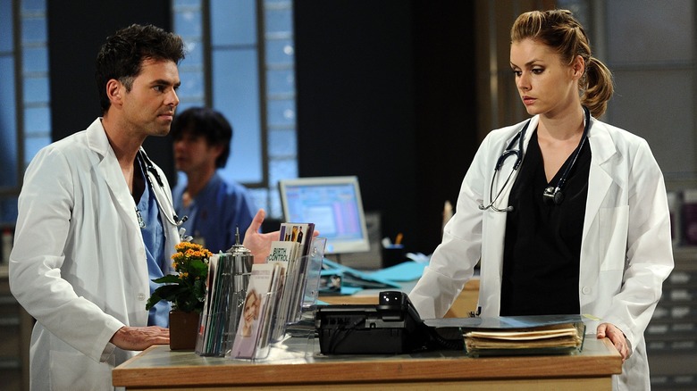 Jason Thompson and Brianna Brown in a scene