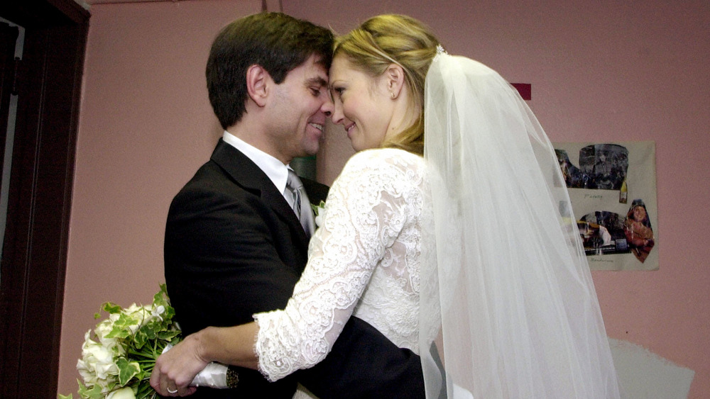 George Stephanopoulos and Ali Wentworth embracing on wedding day