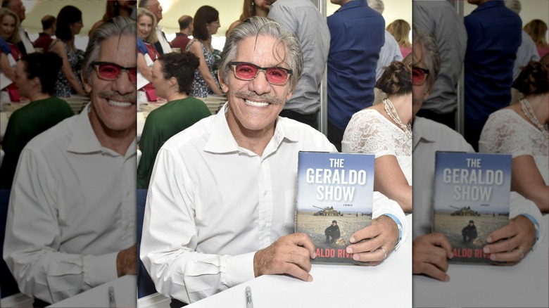 Geraldo Rivera holding his book