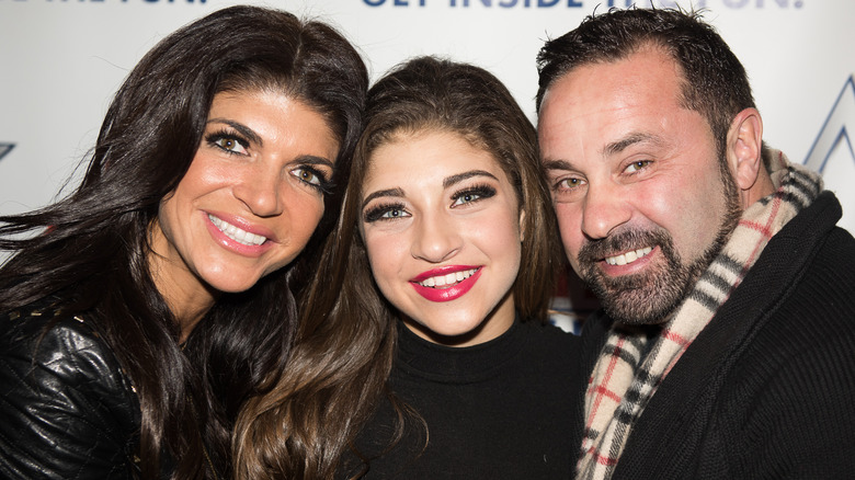 Gia Giudice and her parents, all smiling