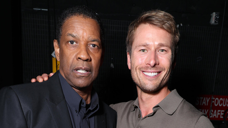 Denzel Washington and Glen Powell smiling