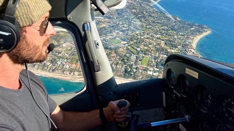 Glen Powell flying plane