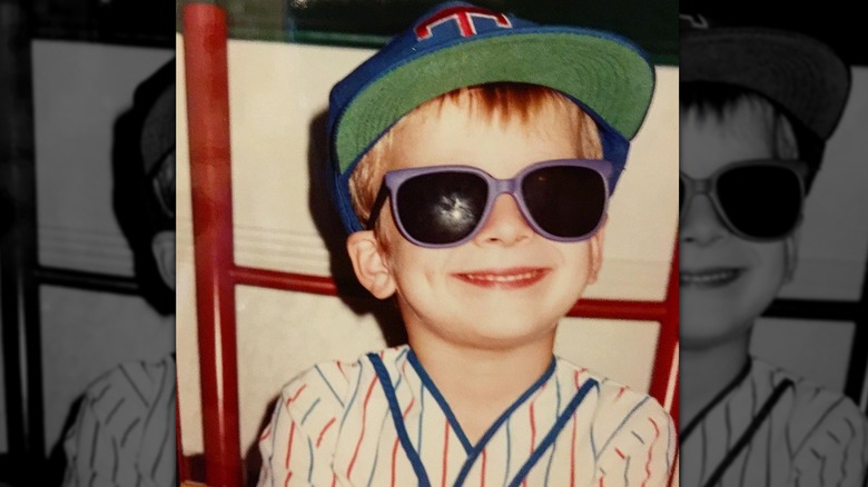 Young Glen Powell grinning