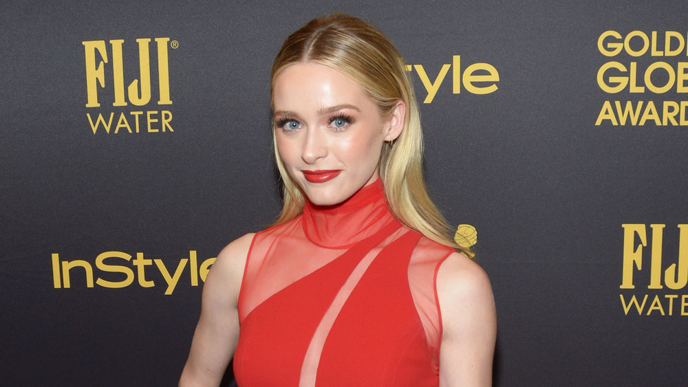 Greer Grammer wearing red at an event