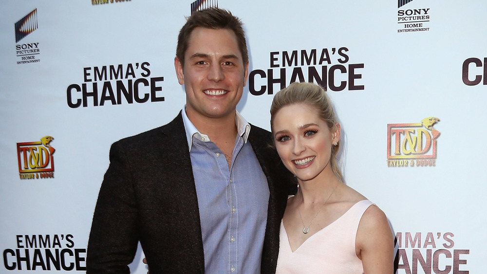 Tyler Konney and Greer Grammer posing together on the red carpet