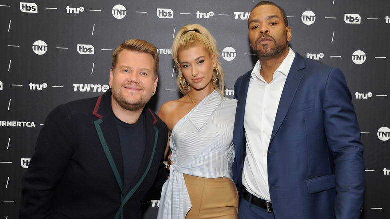 Hailey Bieber posing with James Corden and Method Man