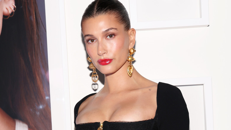 Hailey Bieber in gold drop earrings