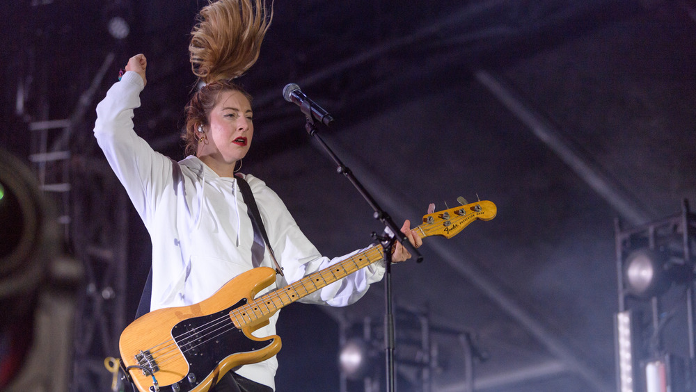 Este Haim rocks out with a guitar