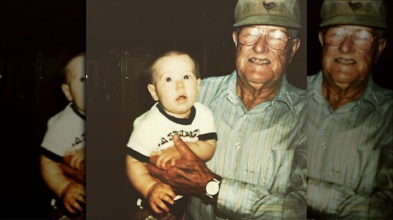 Baby photo of HARDY being held by his grandpa