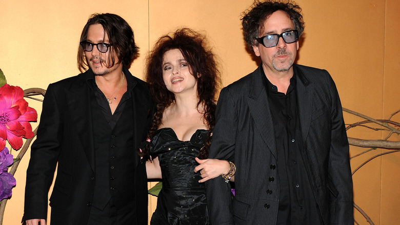 Johnny Depp, Helena Bonham Carter, and Tim Burton posing for a photo