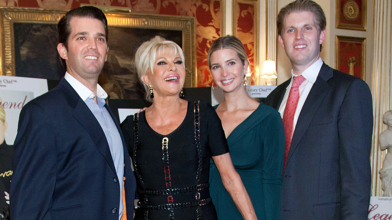 Donald Trump Jr., Ivana Trump, Ivanka Trump, and Eric Trump posing together at an event