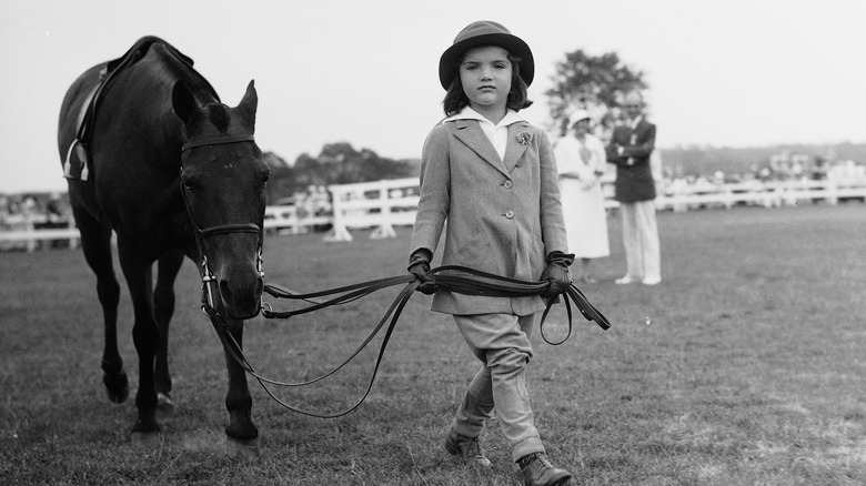 Jackie Kennedy as a little girl with a pony