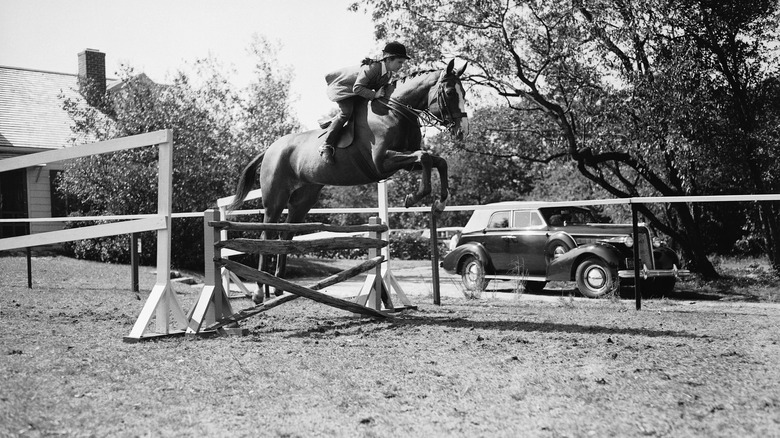 Jackie Kennedy riding a horse in 1938