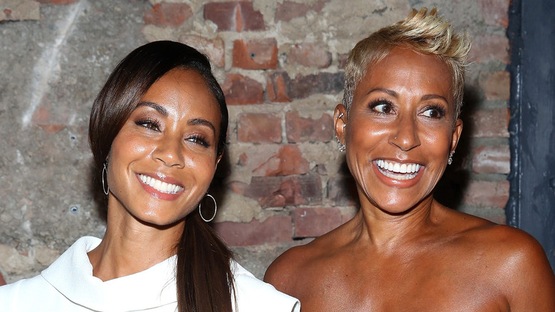 Jada Pinkett Smith smiling and posing with Adrienne Banfield-Norris