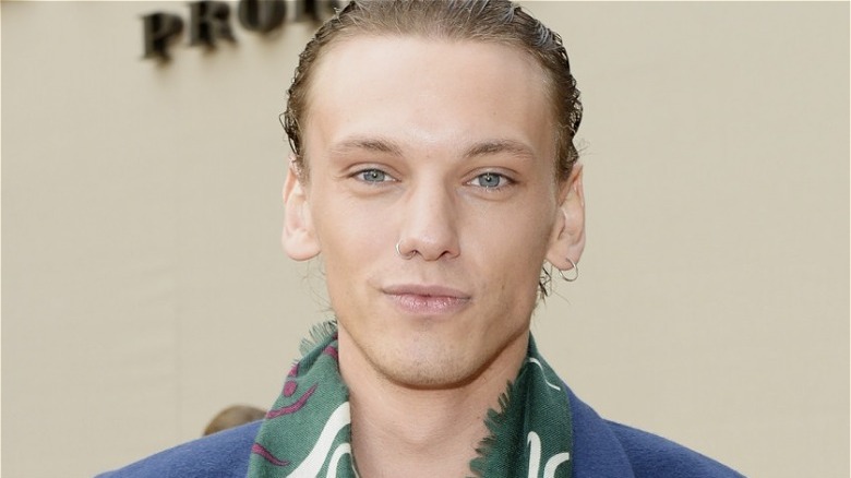 Jamie Campbell Bower at a Burberry event, posing