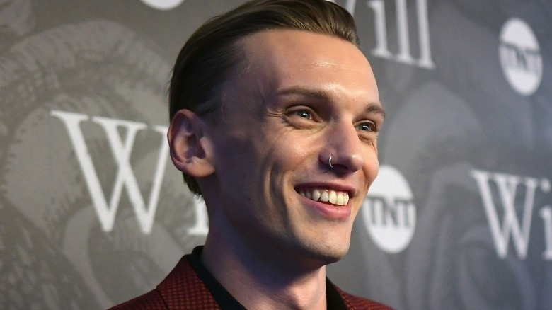 Jamie Campbell Bower smiling