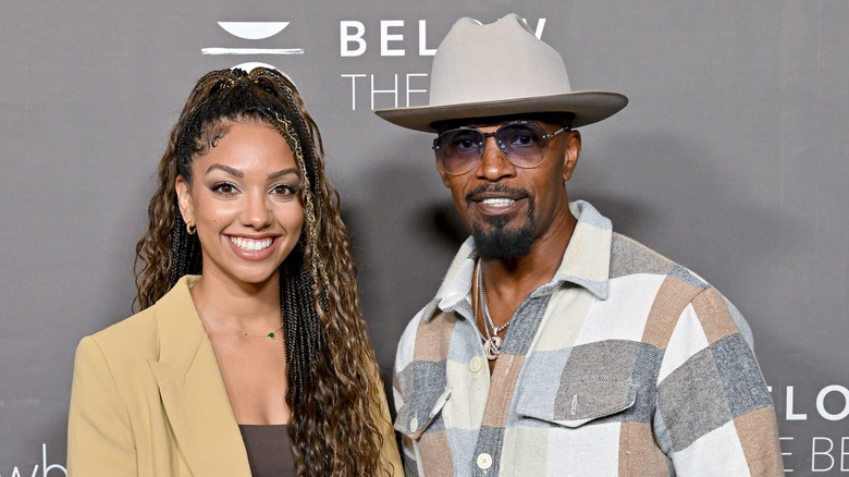 Jamie Foxx smiling with Corinne Foxx