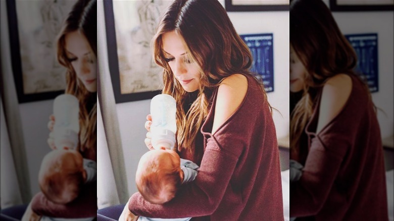 Jana Kramer feeding baby bottle