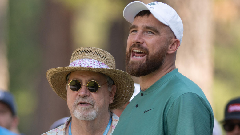 Ed and Travis Kelce wearing hats outside