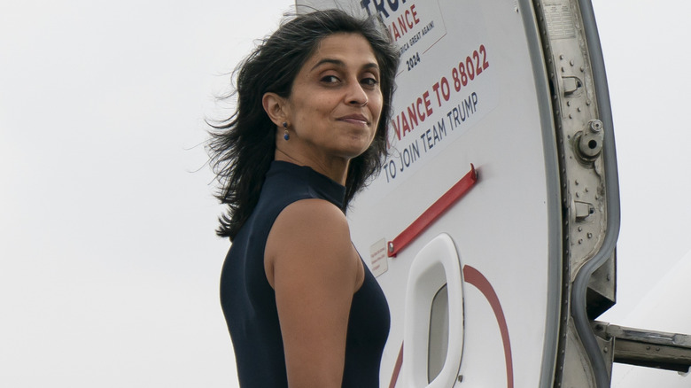 Usha Vance posing for cameras as she enters jet