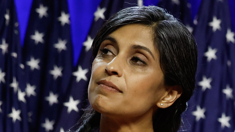 Usha Vance on stage standing near American flags