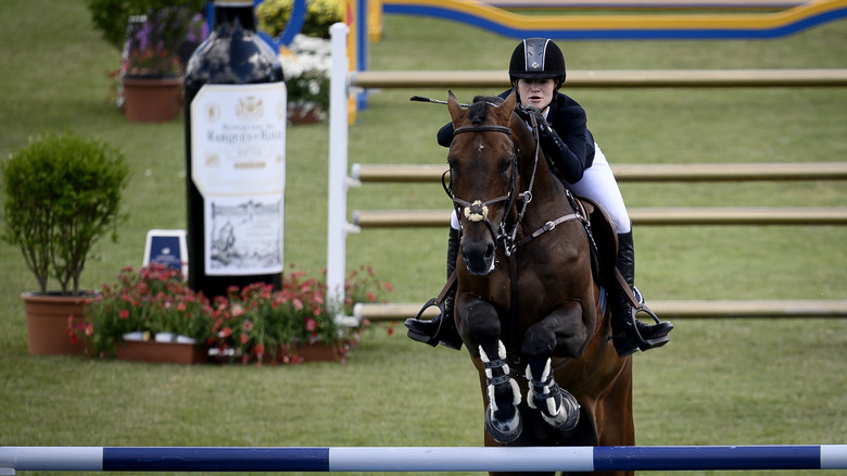 Jennifer Gates riding at an equestrian event in 2019