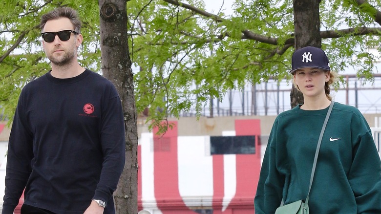 Cooke Maroney walking with Jennifer Lawrence sweatpants