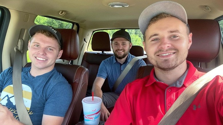 Jeremiah, Jedidiah, and Jason Duggar in a car