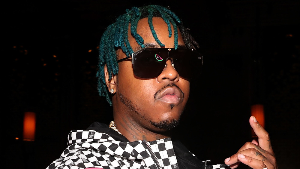 Jeremih in sunglasses with blue hair at an album release party