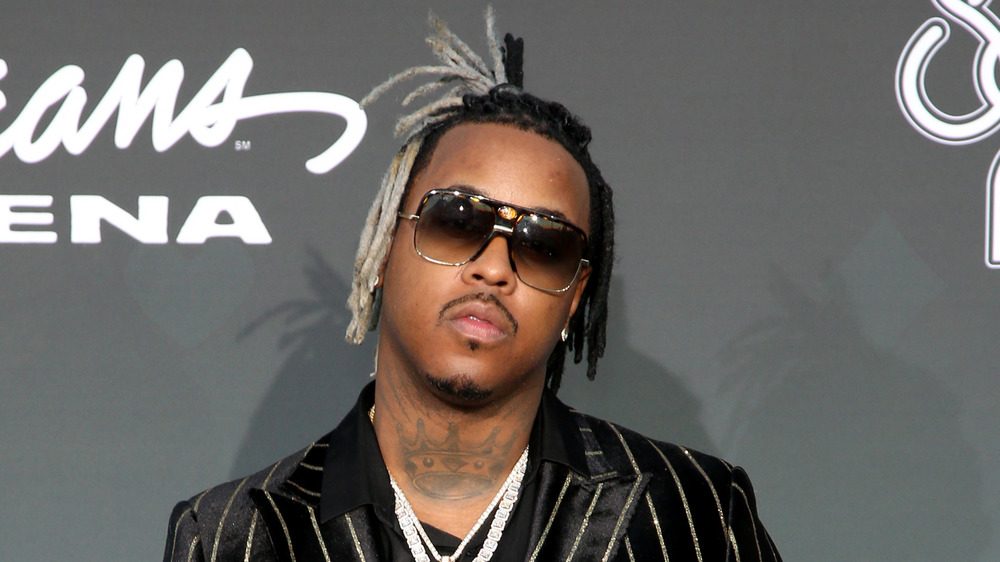 Jeremih in a pin-striped black suit and sunglasses