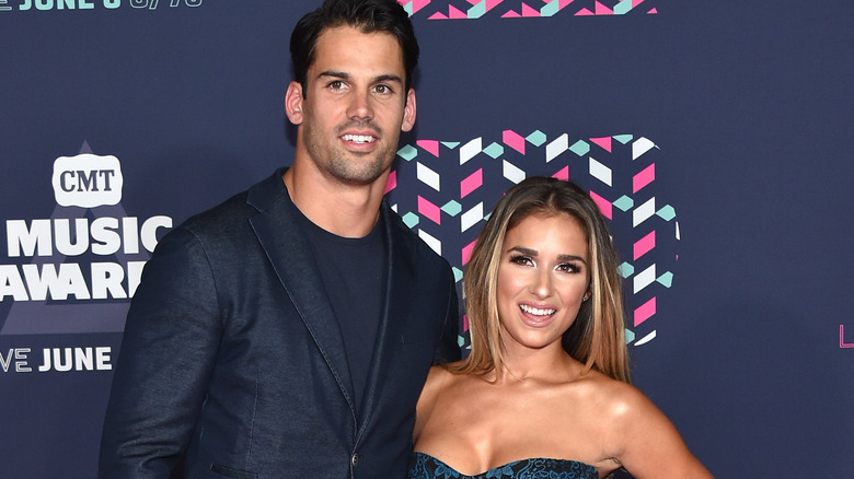 Eric Decker and Jessie James Decker posing together on the red carpet
