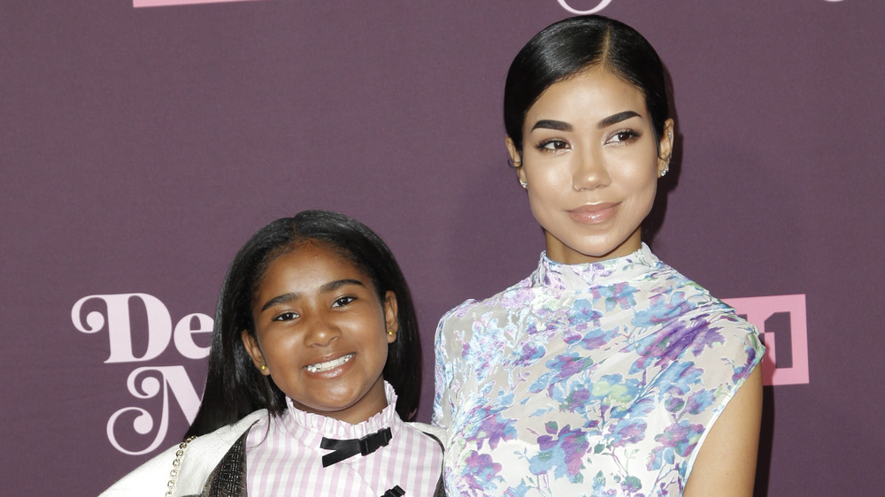 Jhene Aiko posing with her daughter Namiko Love