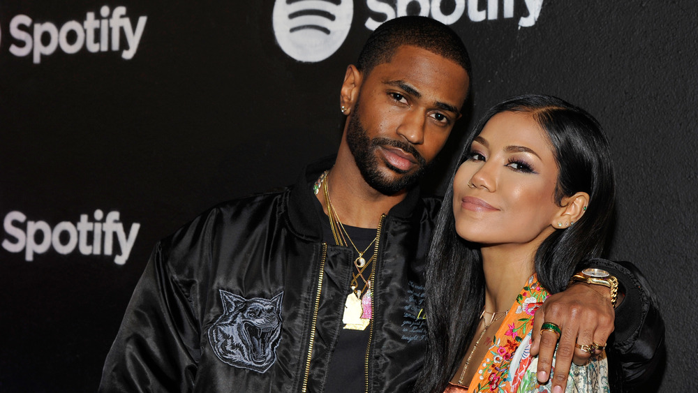 Big Sean and Jhene Aiko  posing for photos together