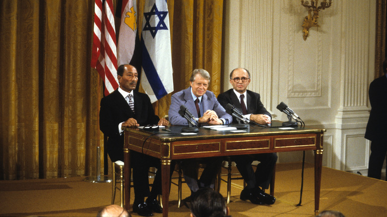 Egyptian President Anwar Al Sadat, Jimmy Carter, and Israeli Prime Minister Menachem Begin