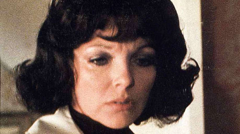 Joan Collins looking down in The Devil Within