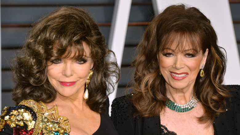 Joan Collins and Jackie Collins, both smiling