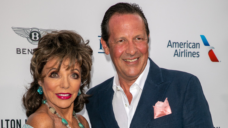 Joan Collins and husband Percy Gibson, both smiling