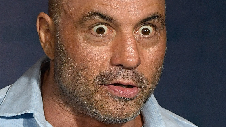 Joe Rogan making a silly face on stage