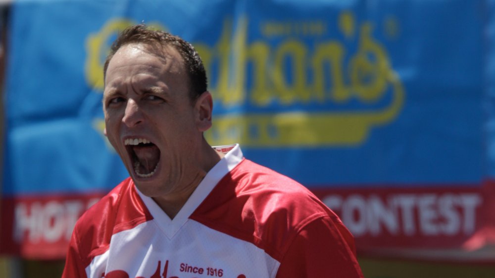 Joey Chestnut yelling at a hot dog eating contest