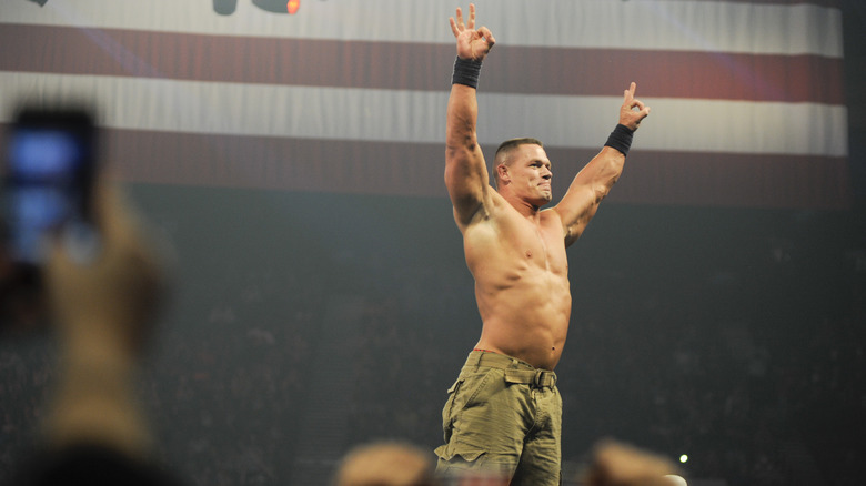 John Cena with his arms up