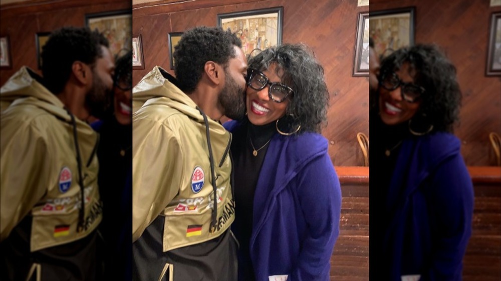 John David Washington kisses his mother Pauletta