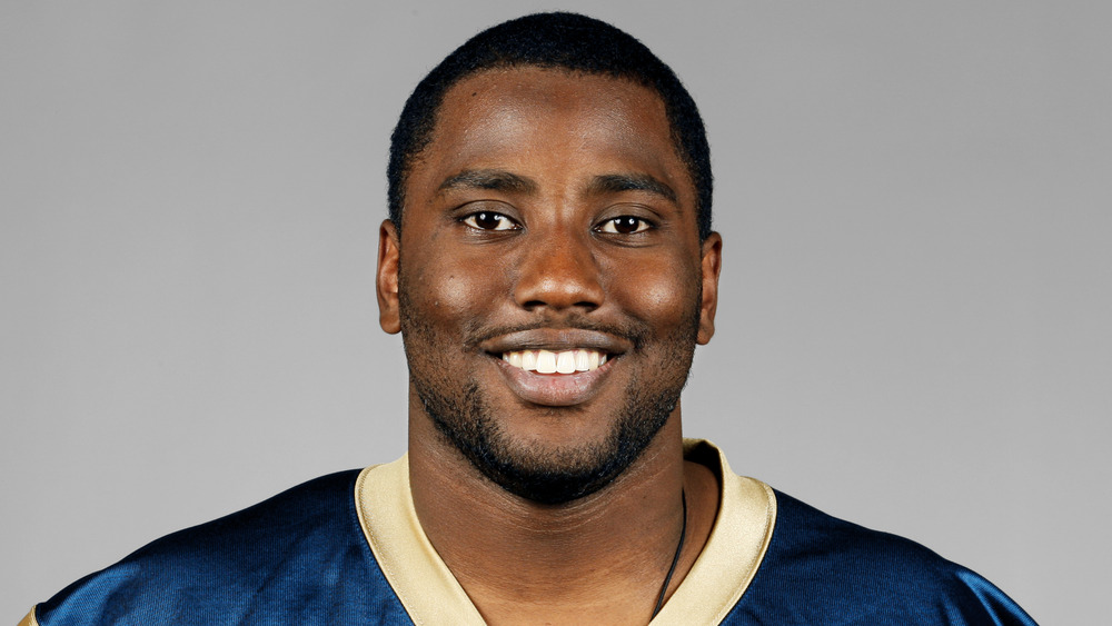 John David Washington in a Rams jersey, smiling