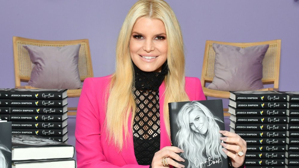 Jessica Simpson poses with her book