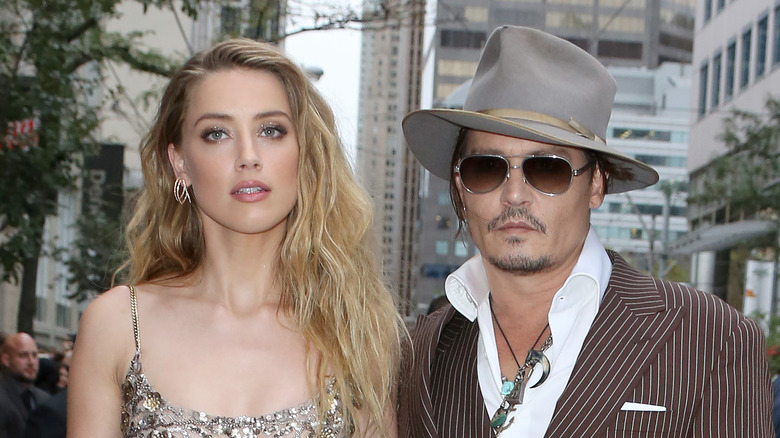 Amber Heard and Johnny Depp in gray 