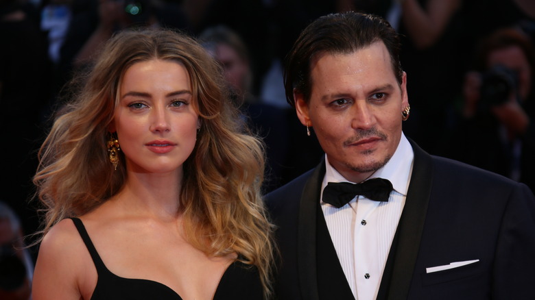 Amber Heard and Johnny Depp in black formalwear