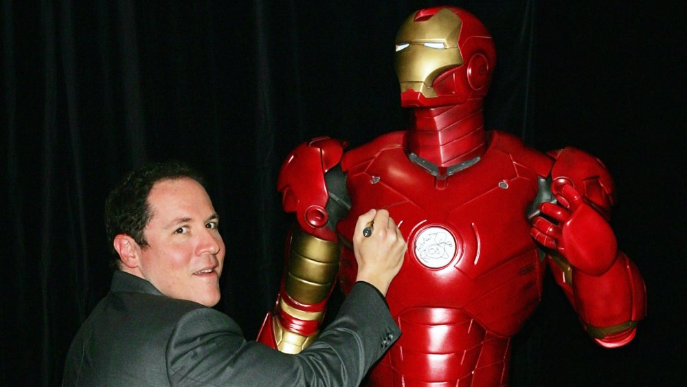 Jon Favreau signing an Iron Man statue