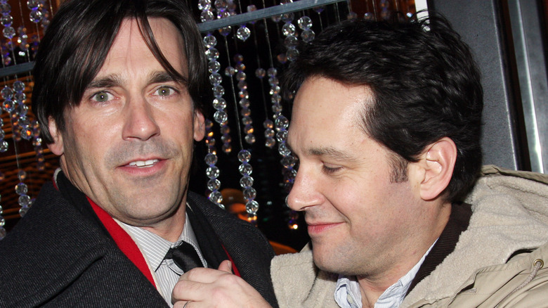 Paul Rudd adjusting Jon Hamm's tie