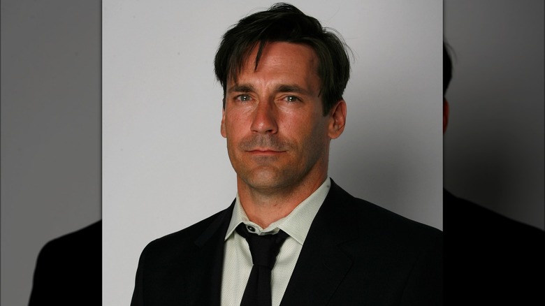 Jon Hamm with a somber expression