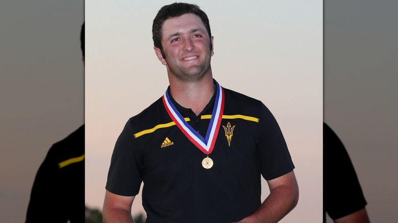 Jon Rahm with a medal around his neck